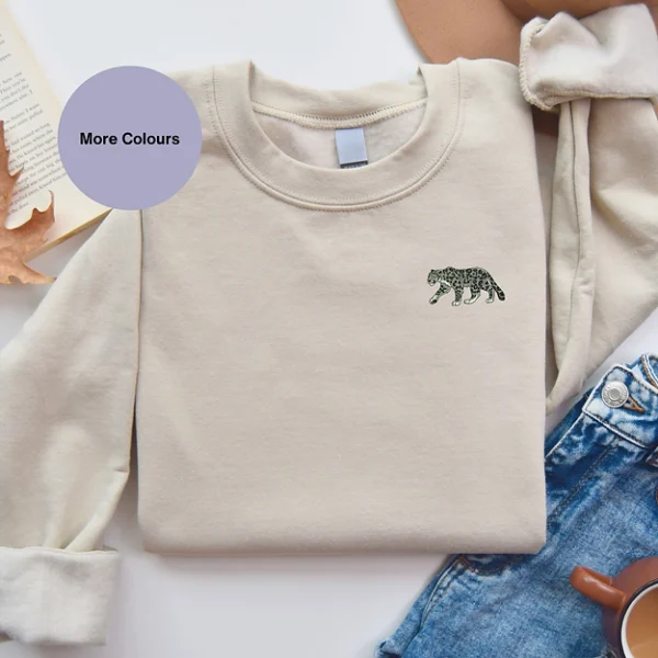 Snow Leopard Embroidered Sweatshirt featuring a detailed wildlife-inspired design, made from soft cotton-faced fabric with brushed back fleece, perfect for nature lovers and stylish fashion