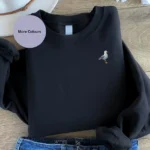 Seagull Embroidered Sweatshirt, Seagull embroidered sweatshirt, animal-themed clothing, seagull lover gift idea, stylish embroidered sweater, customizable embroidered sweatshirt, unisex animal sweater, cozy seagull apparel, bird lover clothing, seagull-themed gift, embroidered animal fashion, unique coastal-inspired sweatshirt.