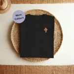 Mushroom Embroidered T-Shirt – Unisex organic cotton tee featuring a small embroidered mushroom. Soft, eco-friendly, and perfect for nature lovers and foragers